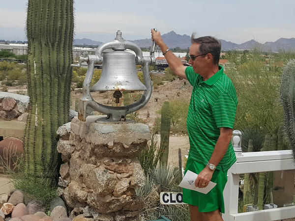 Alan Roesler rings the railroad bell